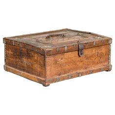 an old wooden box with metal handles and latches on the lid is isolated against a white background