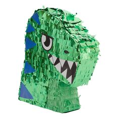 a close up of a green paper bag with a monster face on it's side