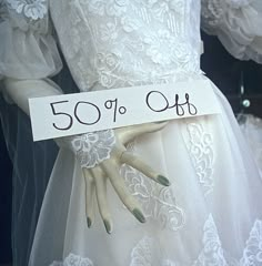 the dress is white and has 50 % off written on it