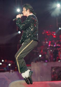 michael jackson performing on stage at a concert