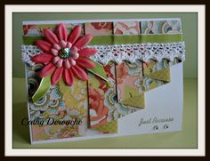 a close up of a greeting card with a flower on the front and bottom corner