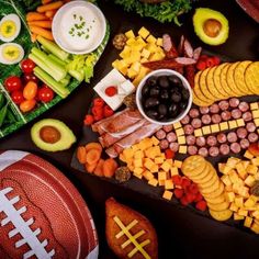 a football themed platter with meat, cheese and veggies