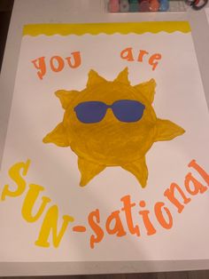 a sign that says you are sun - station with sunglasses on it and the words, you are sun - station