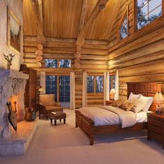 a large log cabin bedroom with a fireplace