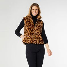 Get fierce in our Ronan Faux Fur Vest! This zip front vest features a bold cheetah print that will make you stand out from the pack. Perfect for adding a touch of wildness to any outfit. Materials: Polyester. Poncho Jacket, Color Vibe, Collar Vest, Tiered Ruffle Dress, Faux Fur Vest, Faux Fur Vests, Scarf Hat, Sweaters And Jeans, Fur Vest