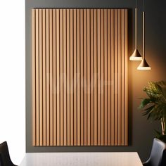 a dining room with a table and chairs next to a wall mounted wooden slatted panel