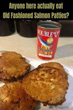 three fried food items on a paper towel next to a can of salmon patties