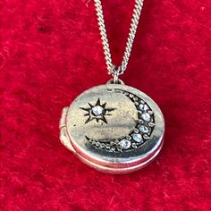 Silver Tone Locket And Chain. Pendant Is Approximately 3/4in Diameter.. And Chain Is Approximately 22 Inches Long. Rhinestones On Star And Moon. New. Never Worn. I’m Not Sure Kind Of Metal This Is.. I Cannot See A Stamp On It. It’s Very Pretty Though! Moon Locket, Shifting Closet, Star Locket, Star And Moon, Dream Jewelry, Chain Pendant, Locket Necklace, Silver Stars, Stars And Moon