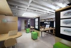 the interior of an office with tables and chairs