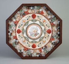 this is an image of a plate with snowflakes and flowers on the surface