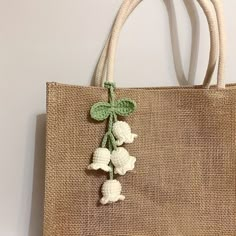 a bag with flowers hanging from it's side