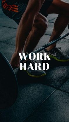 a man squatting on the ground with a barbell in front of him that says work hard