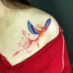 a woman with a tattoo on her shoulder