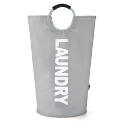 a laundry bag with the word laundry printed on it, hanging from a hook in front of a white background