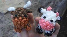 two small crocheted sheeps sitting next to each other