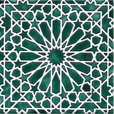 an intricate green and white tile design