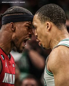 two professional basketball players face to face during a game