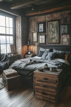 a large bed sitting next to a window in a room with wooden floors and brick walls