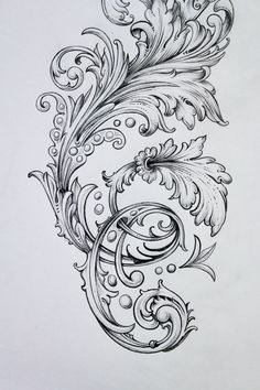 an intricately designed tattoo design on paper with water droplets and swirls in black ink