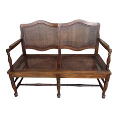 an old wooden bench with wicker seats