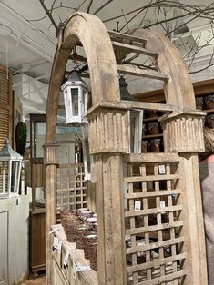 an old wooden structure is being displayed in a shop