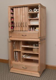 a wooden cabinet with many drawers and shelves