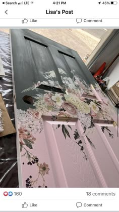 a pink door with flowers painted on it and some other things around the house that are missing