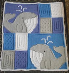 a crocheted blanket with two elephants on it