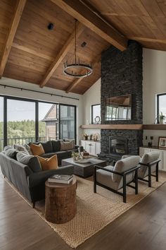 a living room filled with furniture and a fire place in the middle of a room