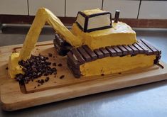 a cake made to look like a bulldozer with chocolate chips on the side