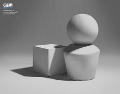 a white object sitting on top of a table next to a square box and cube