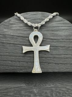 Embrace the timeless symbolism of the Ankh with our versatile jewelry set, featuring both a pendant and fish hook earrings available in your choice of sterling silver or bronze. The Ankh, revered in ancient Egyptian culture, symbolizes life, vitality, and spiritual connection. Crafted with meticulous detail, each piece captures the essence of the Ankh's sacred significance. Whether you opt for the classic elegance of sterling silver or the warm radiance of bronze, this set offers a meaningful expression of ancient wisdom. Wear the pendant close to your heart or adorn your ears with the matching fish hook earrings--each piece resonates with the power of the Ankh, inviting spiritual growth and renewal. This jewelry set is perfect for personal wear or as a thoughtful gift for those intrigued Spiritual Silver Jewelry, Spiritual Silver Jewelry For Ceremonial Occasions, Spiritual White Gold Jewelry, Nickel Free Symbolic Jewelry For Ceremonial Occasions, Spiritual Silver Engraved Jewelry, Spiritual Engraved Silver Jewelry, Engraved Spiritual Silver Jewelry, Symbolic Ceremonial Jewelry Nickel Free, Spiritual Silver Jewelry With Antique Finish