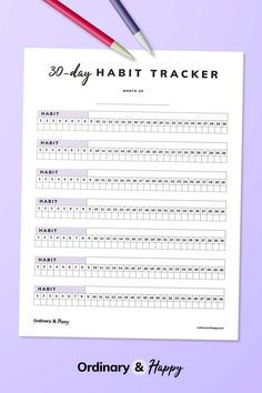 the 30 day habit tracker with two pencils on it