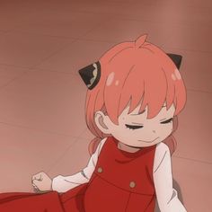 an anime character sitting on the floor with her eyes closed