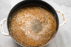 a pot filled with brown liquid on top of a table