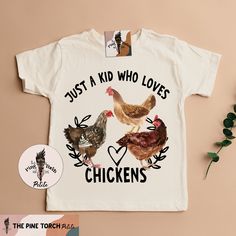 "JUST A KID WHO LOVES CHICKENS: Designed and handmade in Phoenix - ▲Designed and handmade in Phoenix.▲ ▲The \"PETITE\" kids/baby sister shop of THE PINE TORCH® - our main shop with over 100,000 sales and 25,000 5 star reviews - since 2015! ▲ https://www.etsy.com/shop/ThePineTorch 🌈JUST A KID WHO LOVES CHICKENS Can also be changed to: \"Just a boy\" or \"Just a girl\" Locally grown, farm raised, free range! This amazing, hand-drawn, chickens design is gender neutral with a retro flair. This ador Chicken Birthday Shirt, Chicken Shirt Ideas, Chicken Clothes, Chicken Shirts For Kids, Funny Chicken Tshirts, Free Range Kids, Farm Chickens, Funny Chicken Tee Shirts, Chicken Shirt