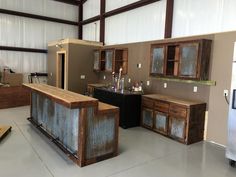 a kitchen with an island made out of metal and wood