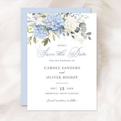 a blue and white floral wedding save the date card