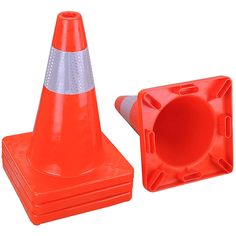 an orange traffic cone next to a set of plastic cones