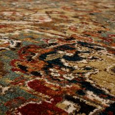 an area rug with many different colors and patterns