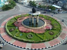 a circular garden in the middle of a road