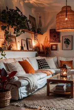 a living room filled with lots of furniture and plants on top of a wooden table