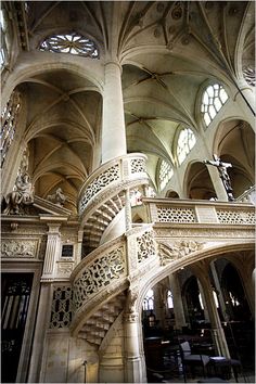 the inside of a large building with many windows and stairs leading up to it's second floor