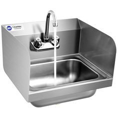 a stainless steel sink with faucet and soap dispenser