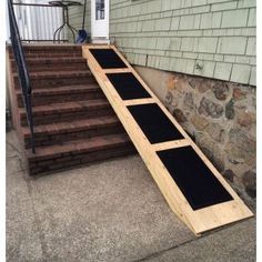 a set of steps leading up to a door on the side of a house that is being built