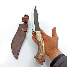 Beautiful crown stag handled knife, blade made of D2 steel. It's heavy duty knife to add in your survival gears. It's perfect knife for all outdoor activities, beautiful piece to add in your knife collections. We do accept custom order's feel to ask for your custom knife. All our knives are handmade, so it can be bit different from photos shown in listings.  Dimensions: Blade: D2 steel Handle: Crown Stag Antler Sheath: Cowhide leather sheath Overall length: 13 inches Blade length: 8 inches Handle length: 5 inches Blade thickness: 4mm  ADD ONS: Complimentary full-grain cowhide leather sheath Keen and precise re-sharpening prior to shipping Personalization available Easy to retrieve. Every knife has its unique pattern on the blade, it is handmade so it can be a little bit different from the Gifts For Men Anniversary, Men Christmas Gift, Luxury Gifts For Men, Gift Luxury, D2 Steel, Hunting Gifts, Knife Collection, Mens Anniversary Gifts, Custom Knife