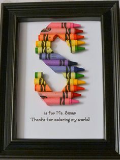 a black frame with colored crayons in it and the word's is for tim, blimar thanks for collecting my world