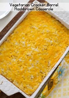 vegetarian cracker barrel hashbrown casserole in a white dish on a wooden board