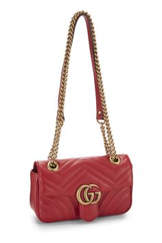 Find GUCCI Gg Marmont Shoulder Bag on Editorialist. This Gucci GG Marmont shoulder bag is crafted from quilted leather and features a gold-tone GG logo on the front. The bag has a flap closure with a push lock and a chain strap that can be worn on the shoulder or crossbody. The bag also has a small interior pocket and a logo lining. It is small in size and is perfect for everyday wear. Gucci Shoulder Bag With Gold-tone Logo Plaque, Gucci Shoulder Bag With Gold-tone Logo For Everyday Use, Gucci Rectangular Shoulder Bag With Gold-tone Logo, Gucci Rectangular Bag With Gold-tone Logo Plaque, Gucci Gold Bag With Gold-tone Logo Plaque, Gucci Quilted Formal Shoulder Bag, Designer Gucci Quilted Bags, Formal Quilted Gucci Bag, Luxury Quilted Gucci Bag