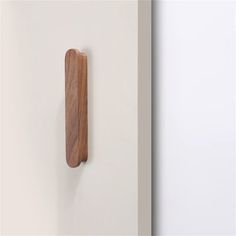 a wooden object mounted to the side of a wall